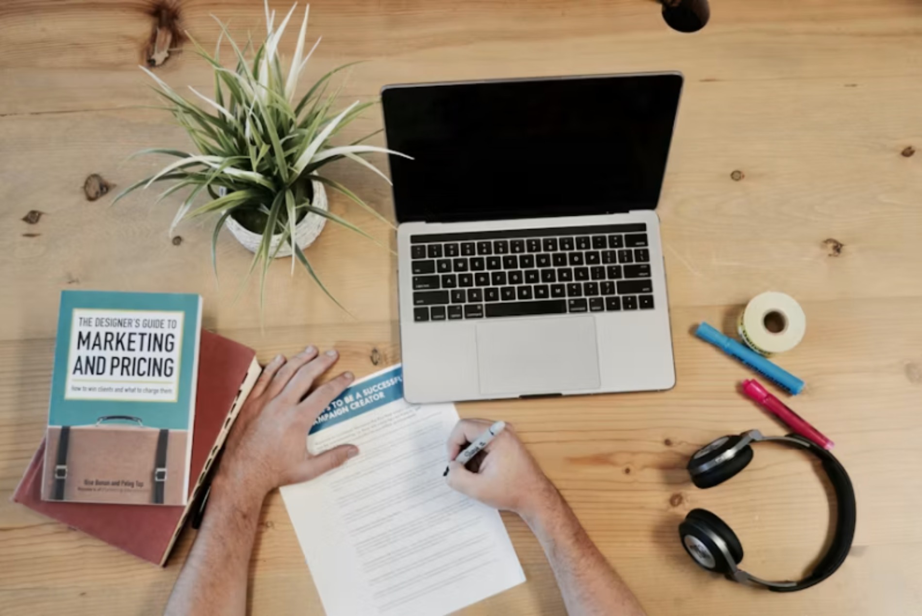 laptop and notebook used to run PPC ads by page seven marketing boutique services.