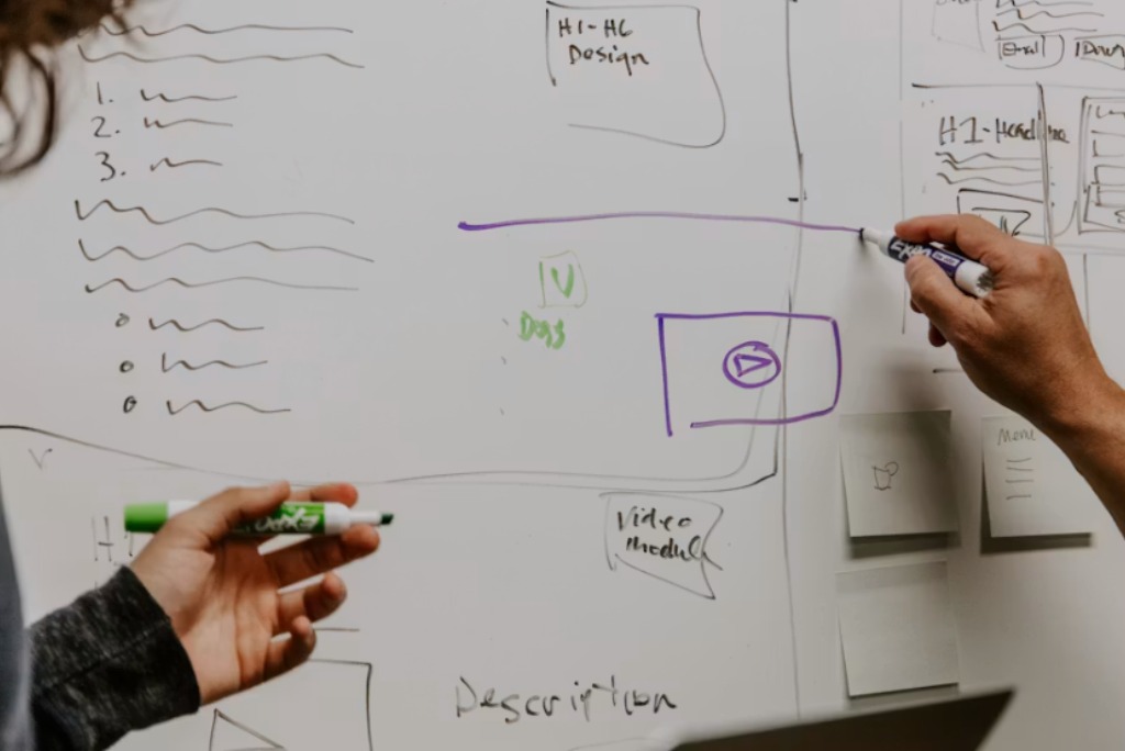 two coworkers trying to create a content strategy like page seven marketing agency uses.